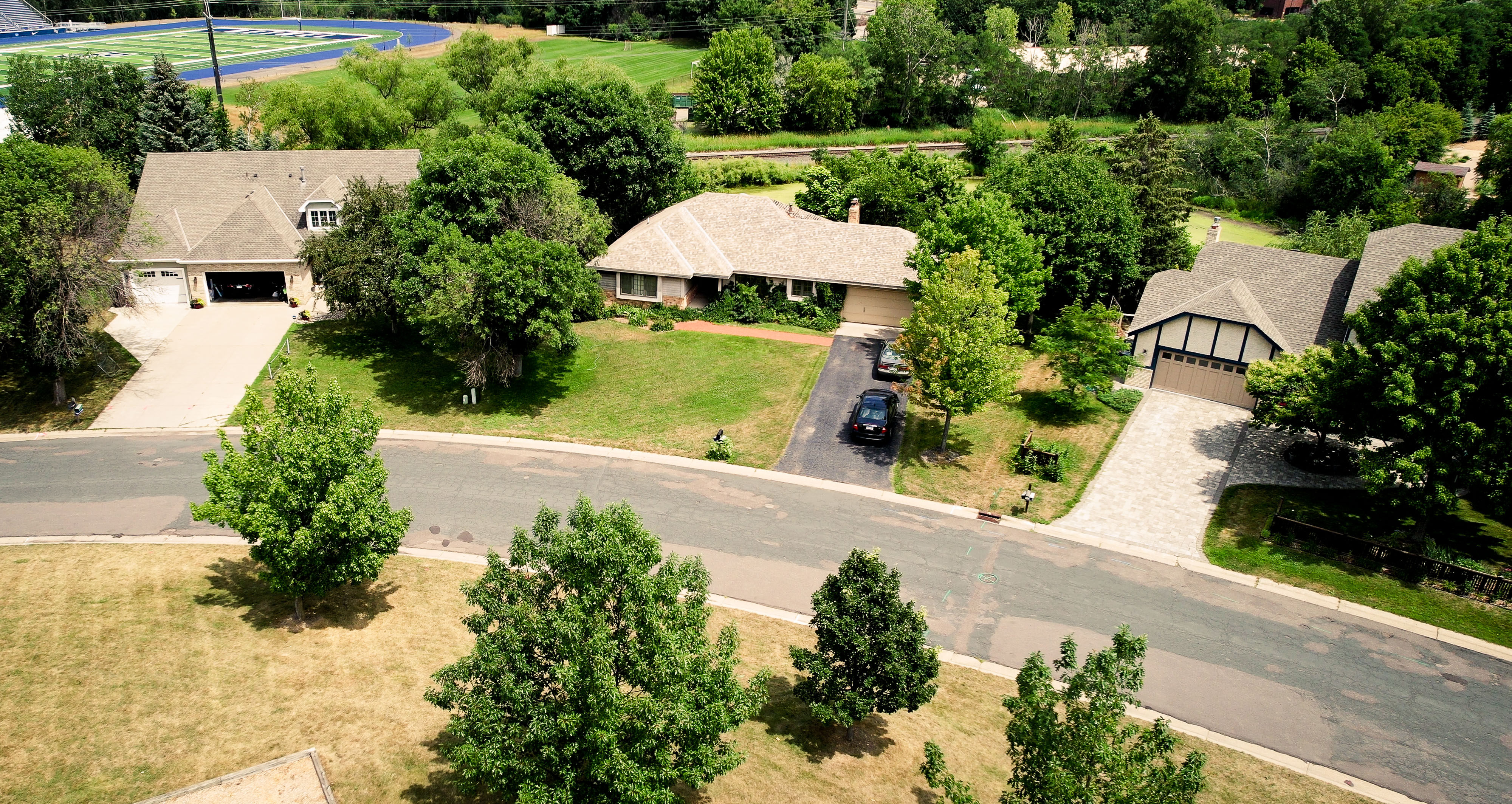 Three houses with background track aerial.jpg