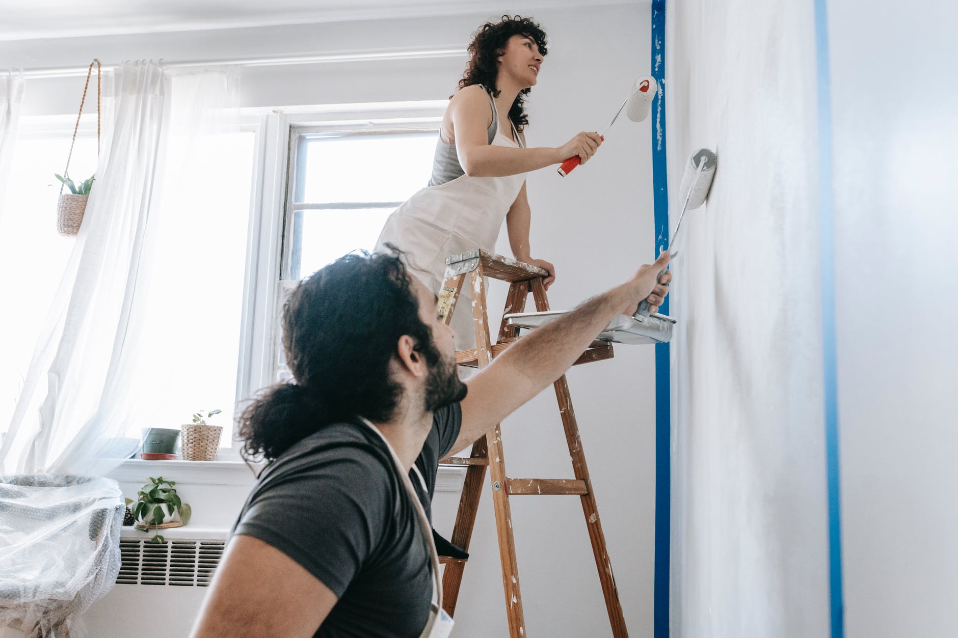 couple painting a room