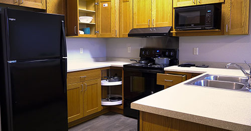 Kitchen with open cupboard