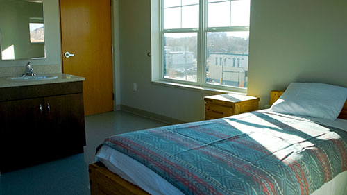 Room with a bed and sink